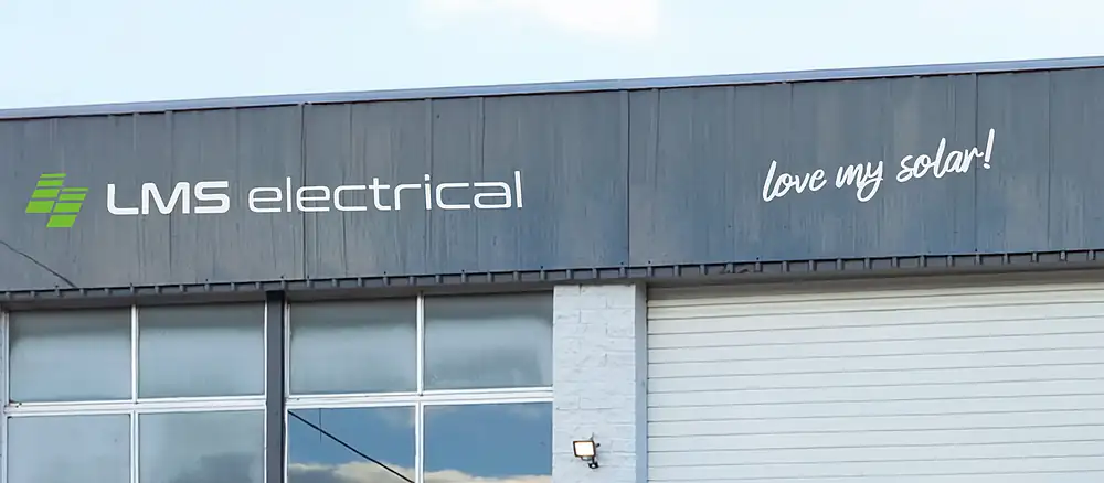 The LMS electrical, love my solar! sign on the front of the Slacks Creek depot
